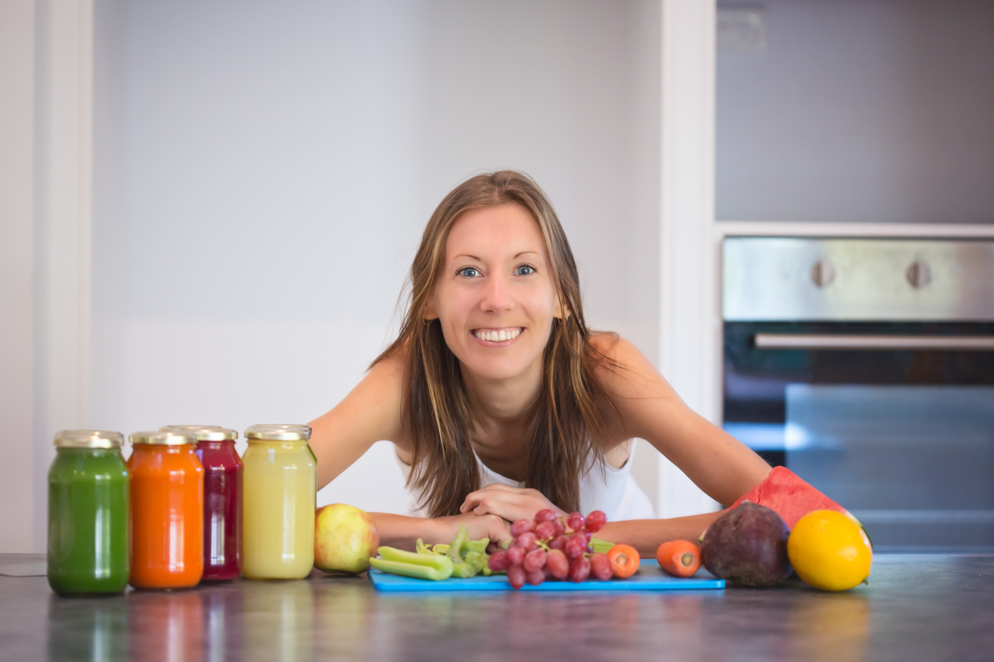 Nadia K in kitchen with fresh juices